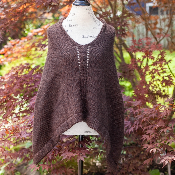 Loom knit poncho/cape pattern by This Moment is Good. The Rebecca Poncho has bea